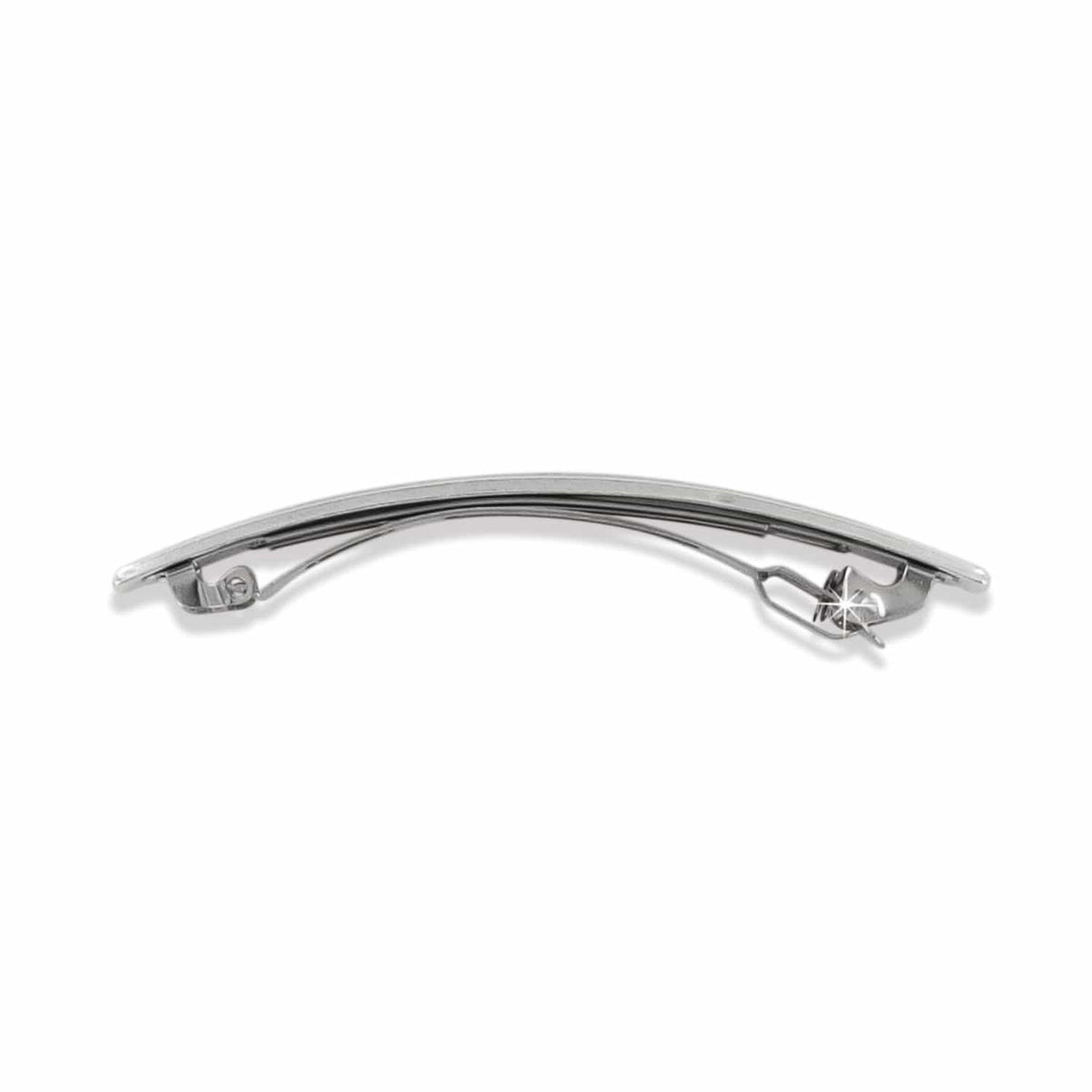 Brighton hair barrette with curved silver-plated finish shown from the back with clasp mechanism on a white background