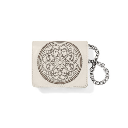 Brighton ivory leather card wallet with embossed medallion design and silver-tone chain wristlet on a white background