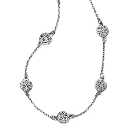 Brighton station necklace with silver-plated openwork filigree medallions on a delicate chain on a white background