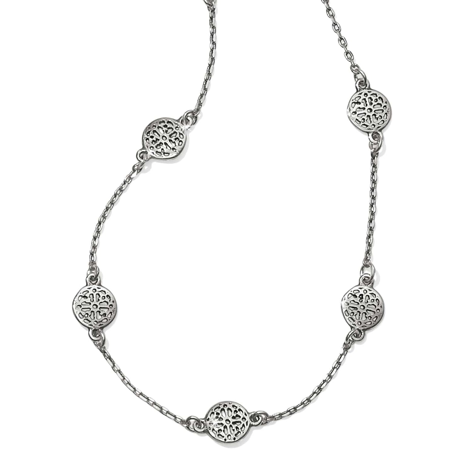 Brighton station necklace with silver-plated openwork filigree medallions on a delicate chain on a white background