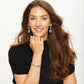 Model wearing Brighton silver-plated filigree drop earrings with coordinating Brighton bracelet and ring accessories