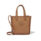 Brighton tote handbag in tan leather with whipstitched edges, embossed medallion, and crossbody strap on a white background