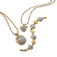 Brighton jewelry set with two gold-plated chain necklaces and matching bracelet featuring silver-plated filigree medallions on a white background