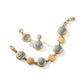 Brighton bracelet and drop earrings set with silver-plated filigree medallions, brushed gold-plated discs, and crystal accents on a white background