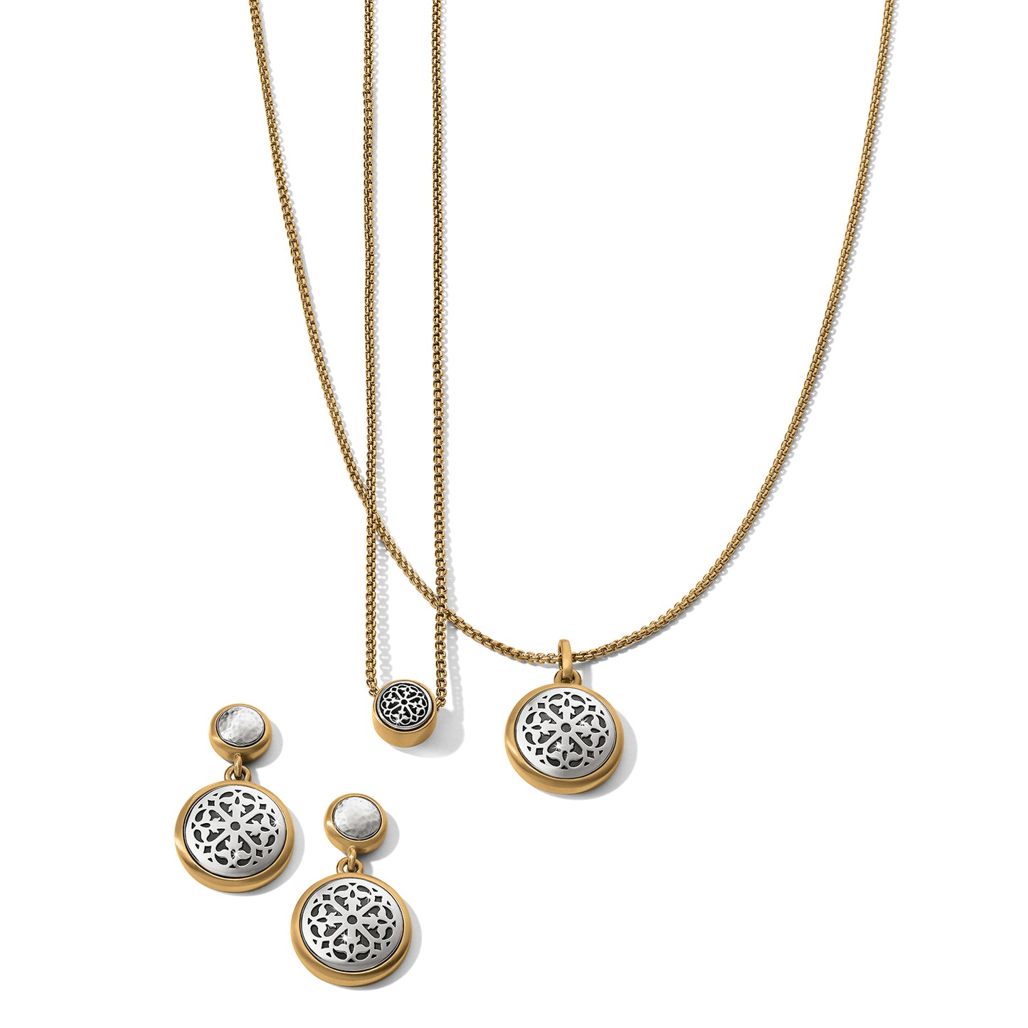 Brighton necklaces and earrings set with silver-plated filigree medallions and brushed gold-plated chains on a white background