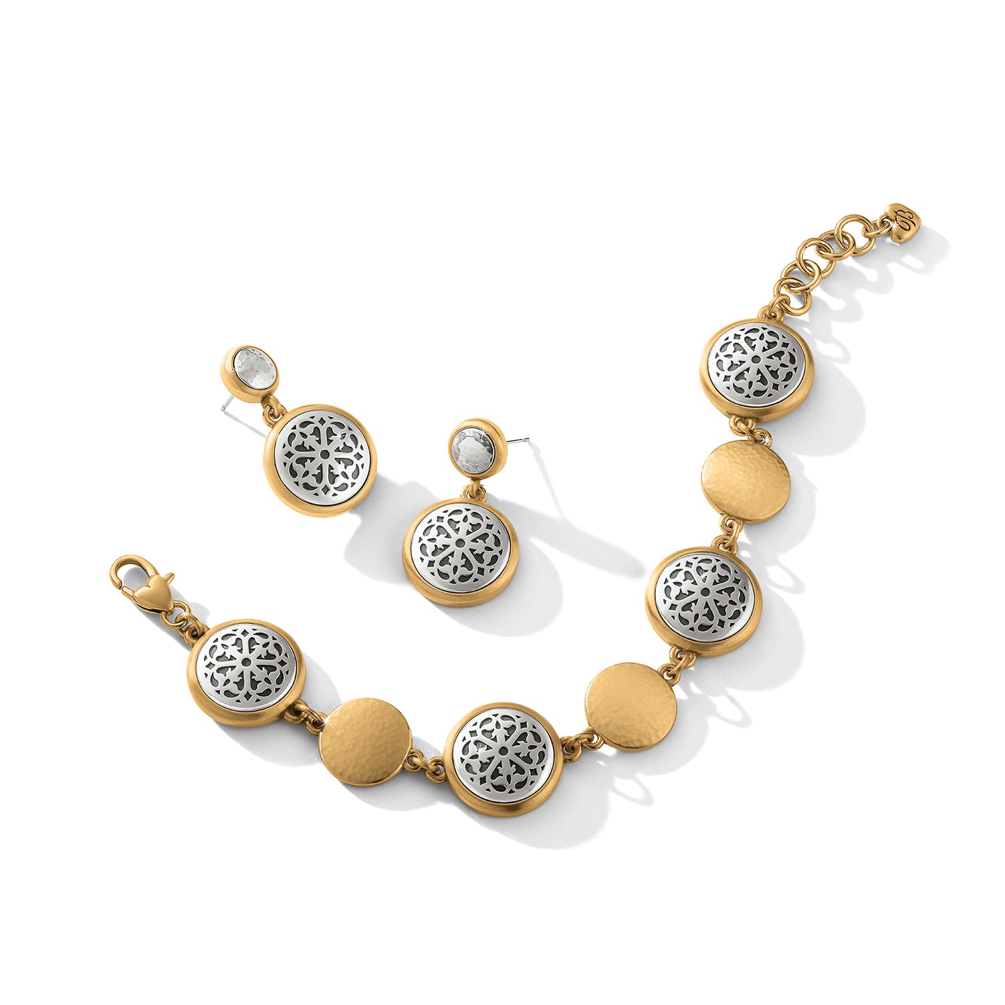 Brighton bracelet and drop earrings with silver-plated filigree medallions and brushed gold-plated discs on a white background