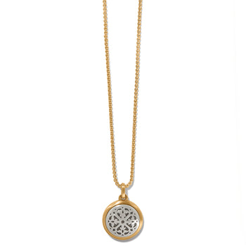 Brighton pendant necklace with brushed gold-plated chain and silver-plated round openwork medallion on a white background