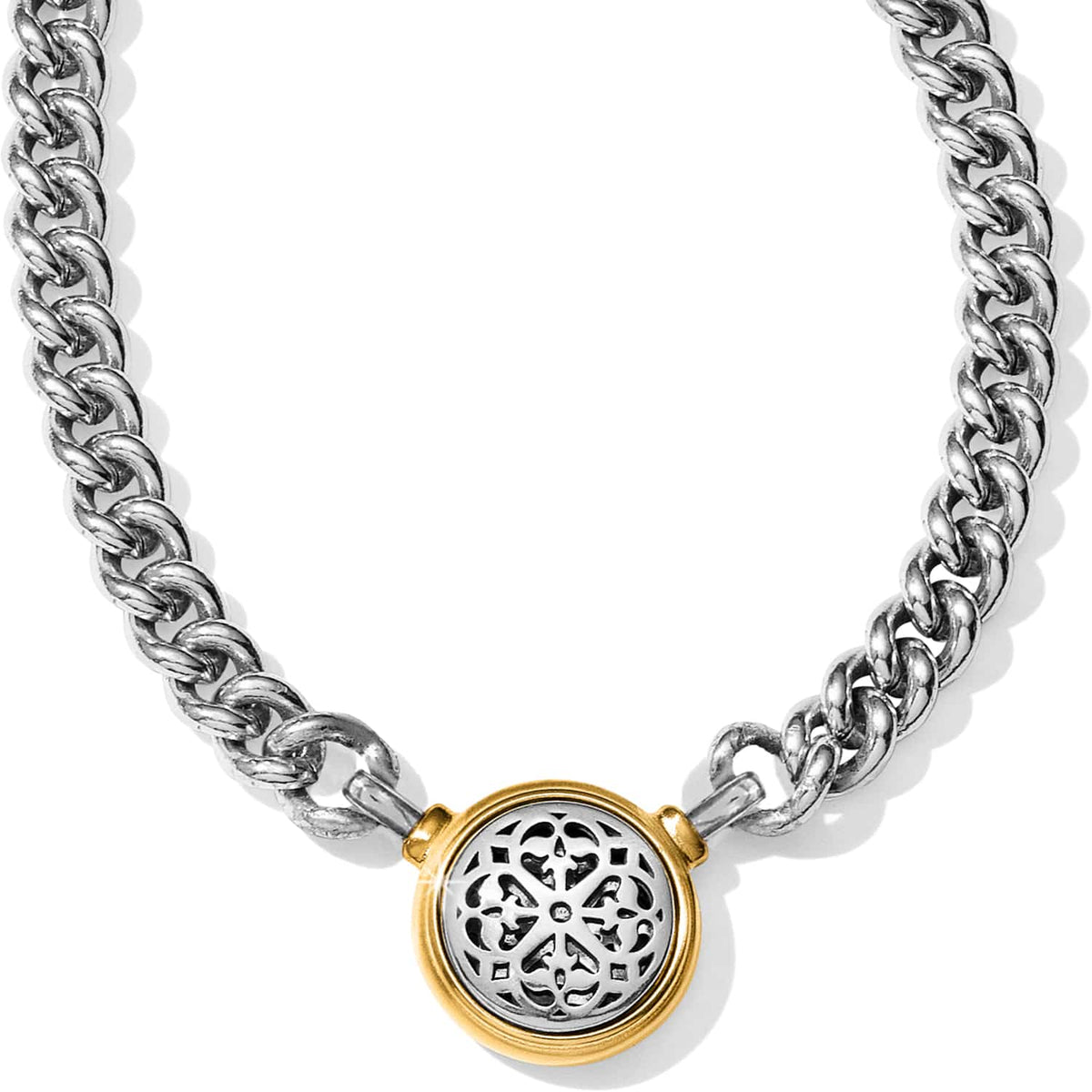 Brighton necklace with silver-tone curb chain and two-tone round filigree medallion pendant on a white background