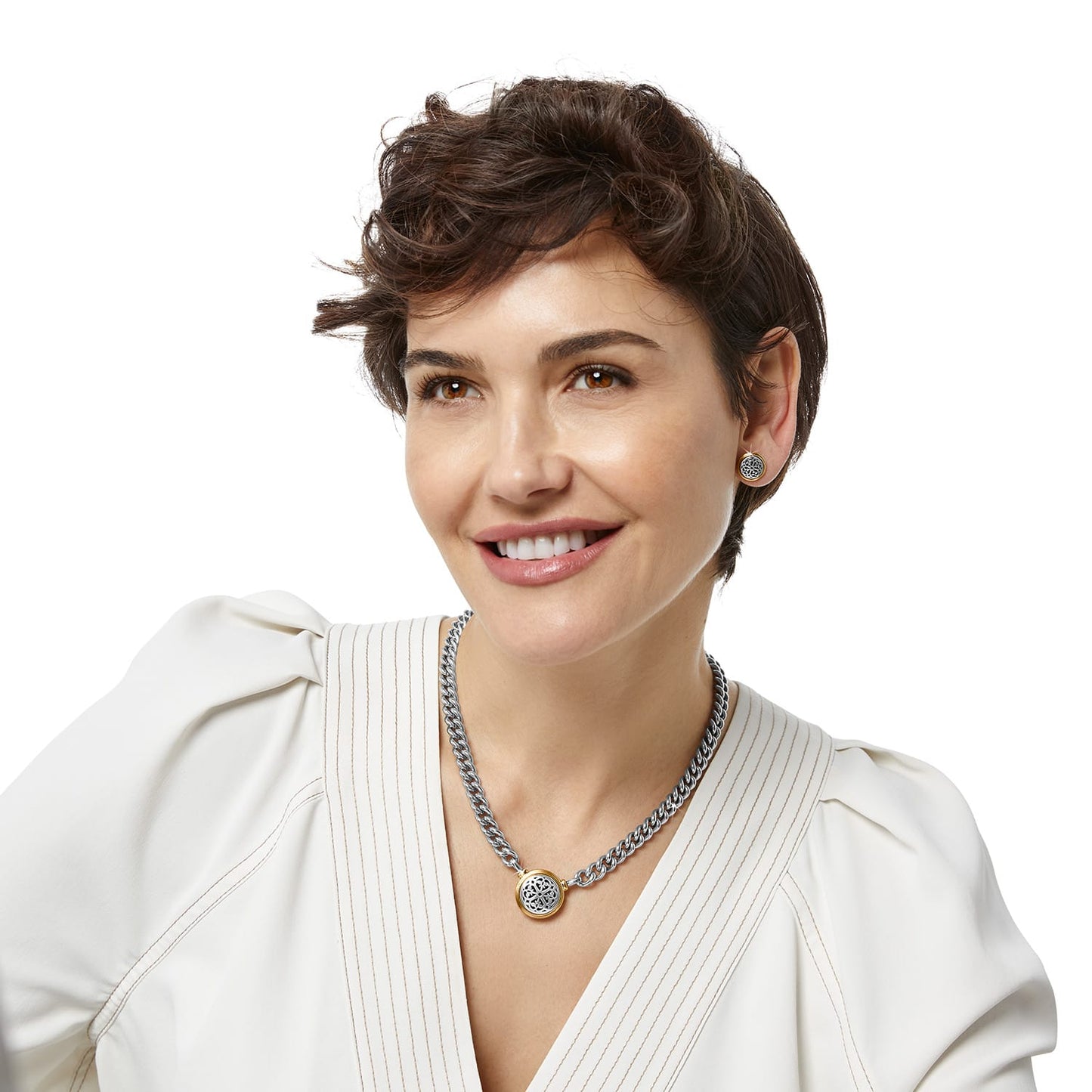 Model wearing a Brighton two-tone medallion pendant necklace on curb chain paired with matching two-tone stud earrings