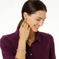 Model wearing Brighton two-tone medallion stud earrings with coordinating Brighton necklace, ring, and bracelet accessories