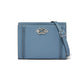Brighton blue leather crossbody handbag with silver-tone knot clasp, braided side details, and adjustable strap on a white background