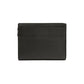 Brighton handbag shown from the back with black pebbled leather and minimal stitching on a white background