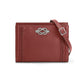 Brighton red leather crossbody handbag with silver-tone knot accent, braided side detail, and adjustable strap on a white background