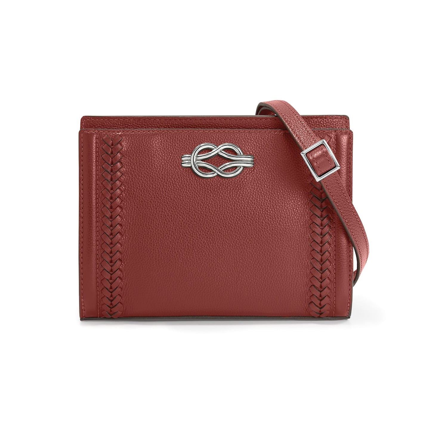 Brighton red leather crossbody handbag with silver-tone knot accent, braided side detail, and adjustable strap on a white background