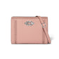 Brighton pink leather crossbody handbag with silver-tone knot accent, woven side details, and adjustable strap on a white background