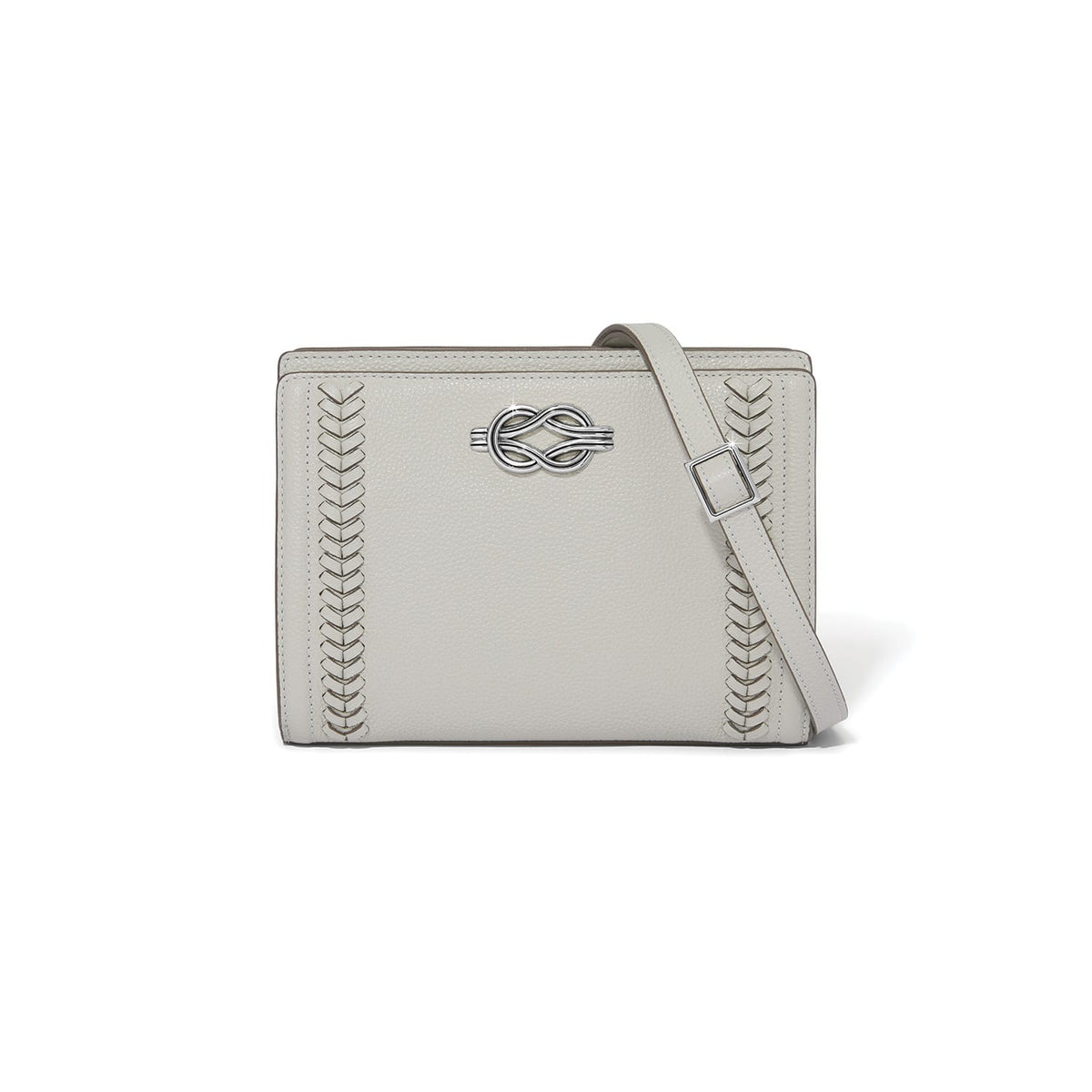 Brighton crossbody handbag in light gray leather with silver-tone knot accent and woven side details on a white background