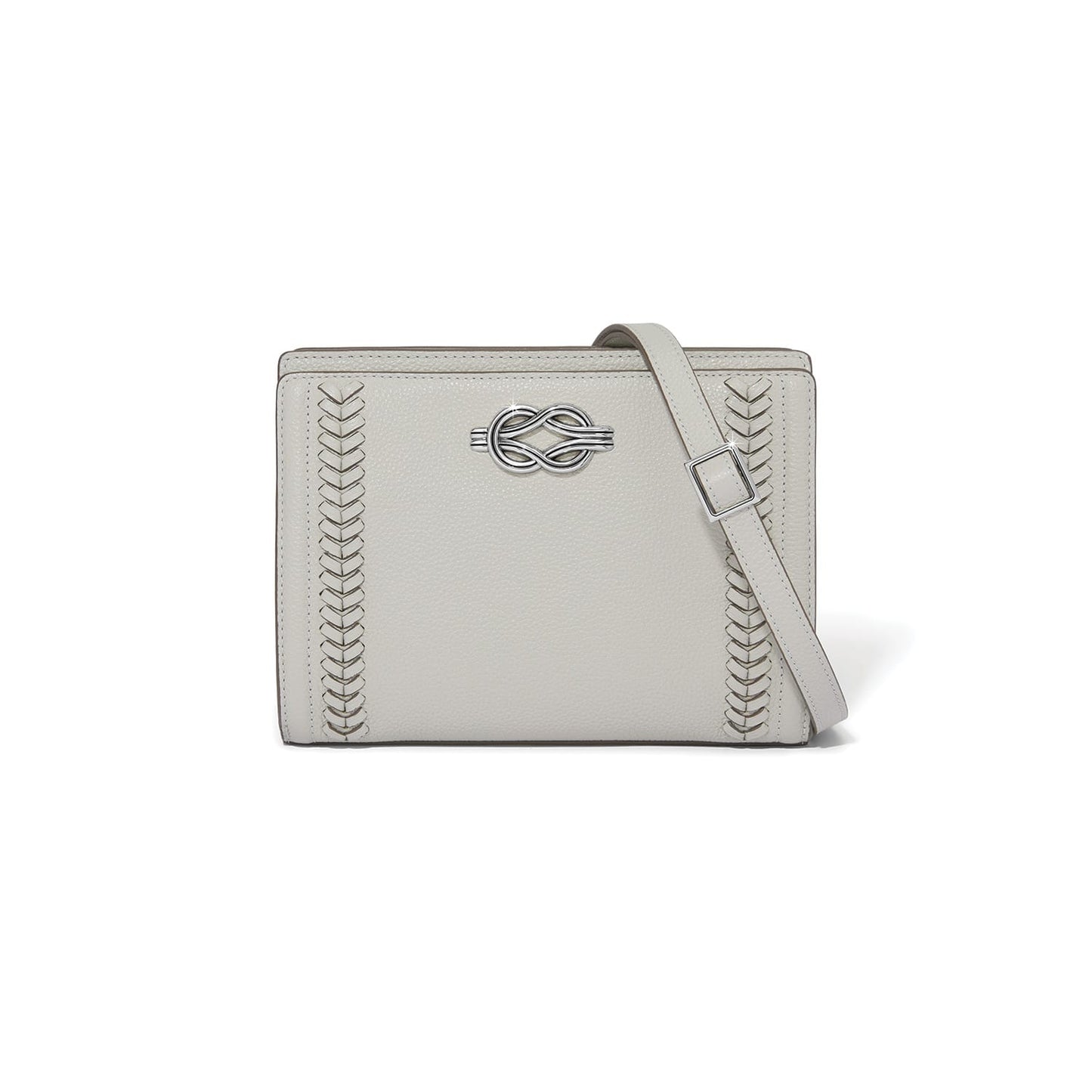 Brighton crossbody handbag in light gray leather with silver-tone knot accent and woven side details on a white background