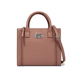Brighton handbag in mauve leather with silver-tone knot clasp, braided side details, and adjustable strap on a white background