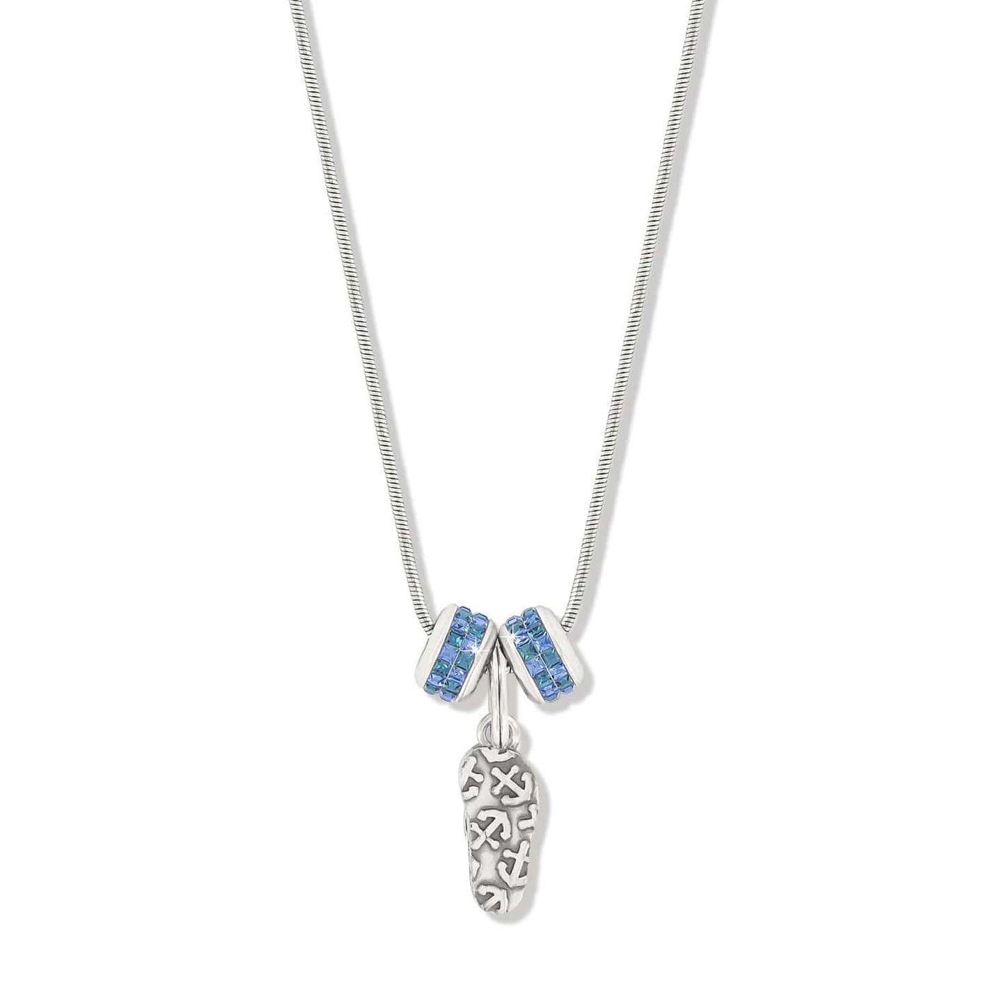 Brighton charm necklace with silver-plated sandal pendant and two blue crystal rondelle charms on a white background