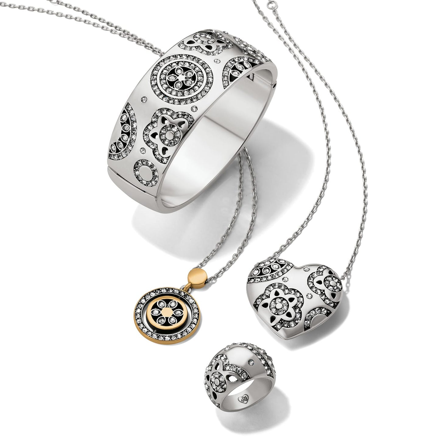 Brighton silver-plated jewelry set styled with bangle, heart pendant necklace, ring, and crystal-accented pendant necklace