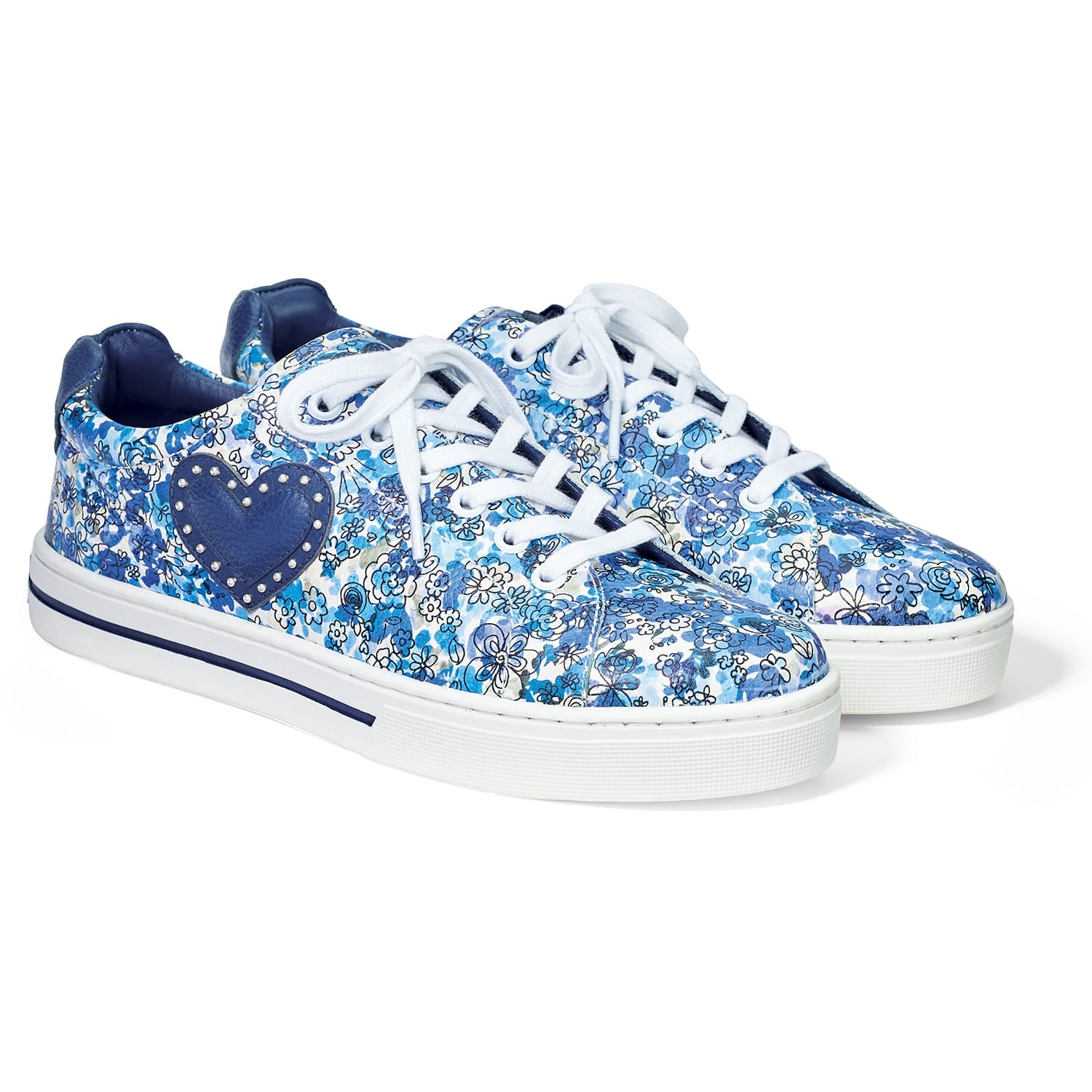 Brighton leather sneakers with blue floral print, navy heart appliqué, studded accents, and white laces on a white background