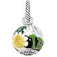 Brighton charm pendant with white and yellow daisy enamel design and silver-plated rope bail on a white background
