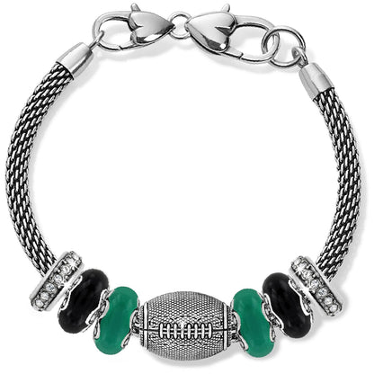 Brighton charm bracelet with silver-plated football bead, green and black beads, and crystal accents on a white background