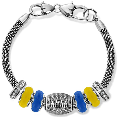 Brighton charm bracelet with silver-plated football bead, yellow and blue beads, and crystal accents on a white background