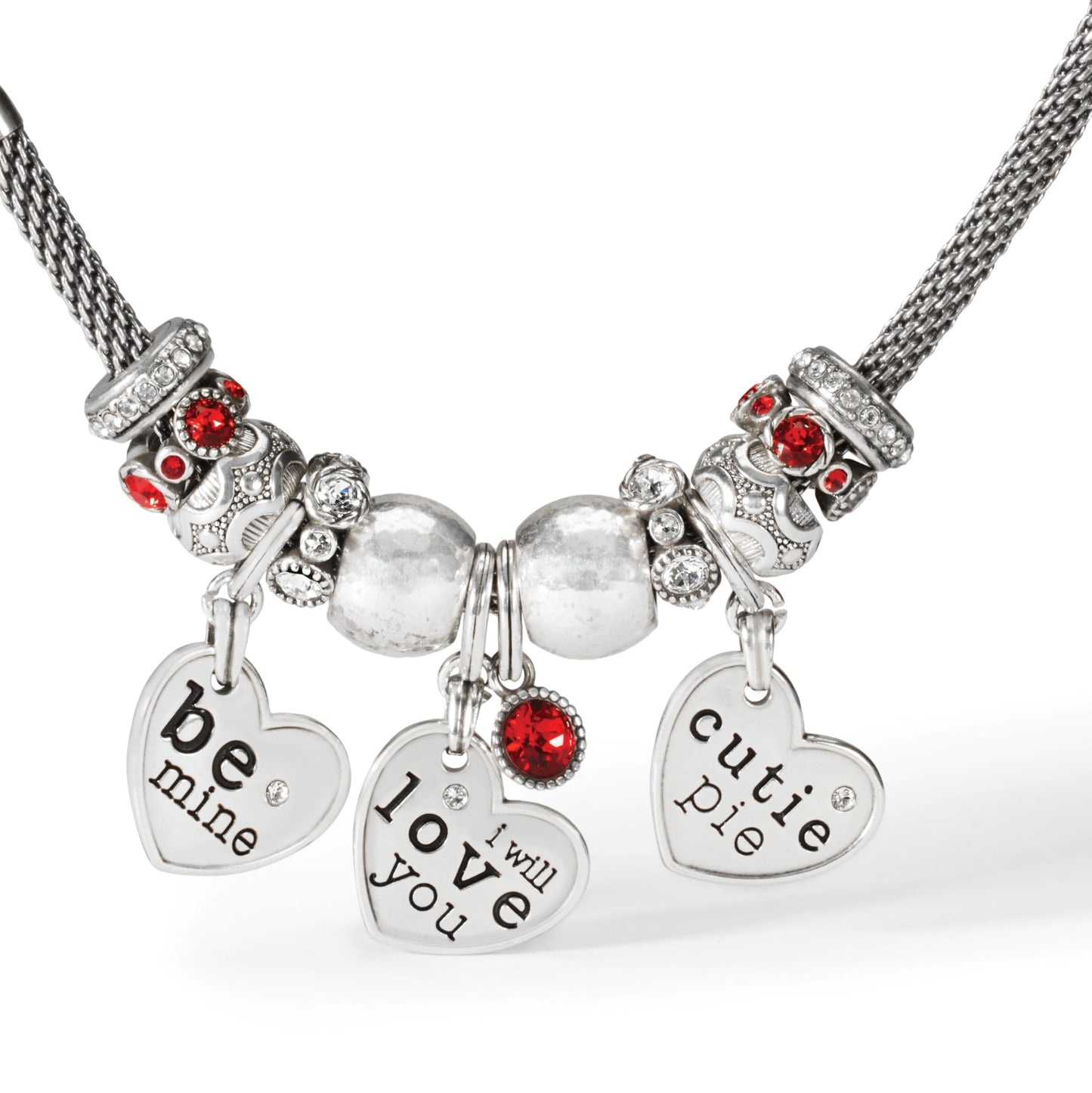 Close-up of Brighton silver-plated necklace with heart charms reading be mine, love you, cutie pie, and red crystals