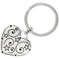 Brighton keychain with silver-plated heart charm featuring swirl and star engravings and split ring on a white background