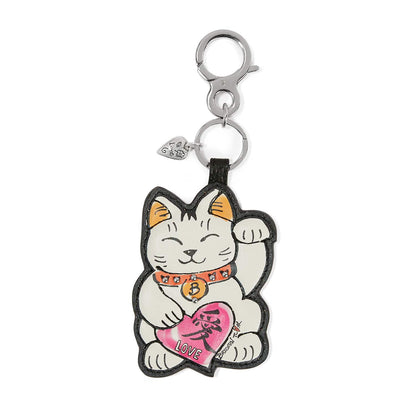 Brighton leather bag charm with illustrated lucky cat holding pink heart and silver-tone clasp on a white background