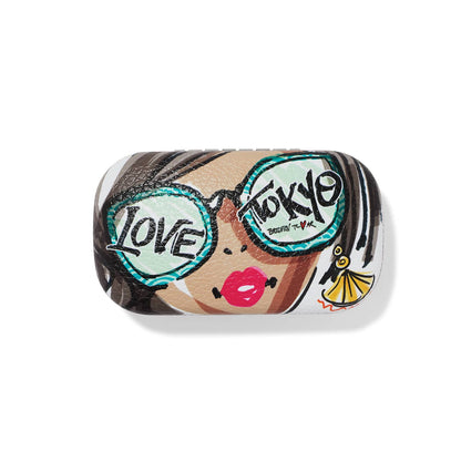 Brighton eyeglass case with illustrated woman wearing Love Tokyo sunglasses and pink lips graphic print on a white background