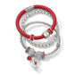 Brighton bracelet set with red leather band, silver-plated beaded bangles, crystal charms, and enamel teddy bear on a white background