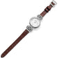 Brighton watch with brown leather strap, silver-plated woven knot accents, and round white dial on a white background