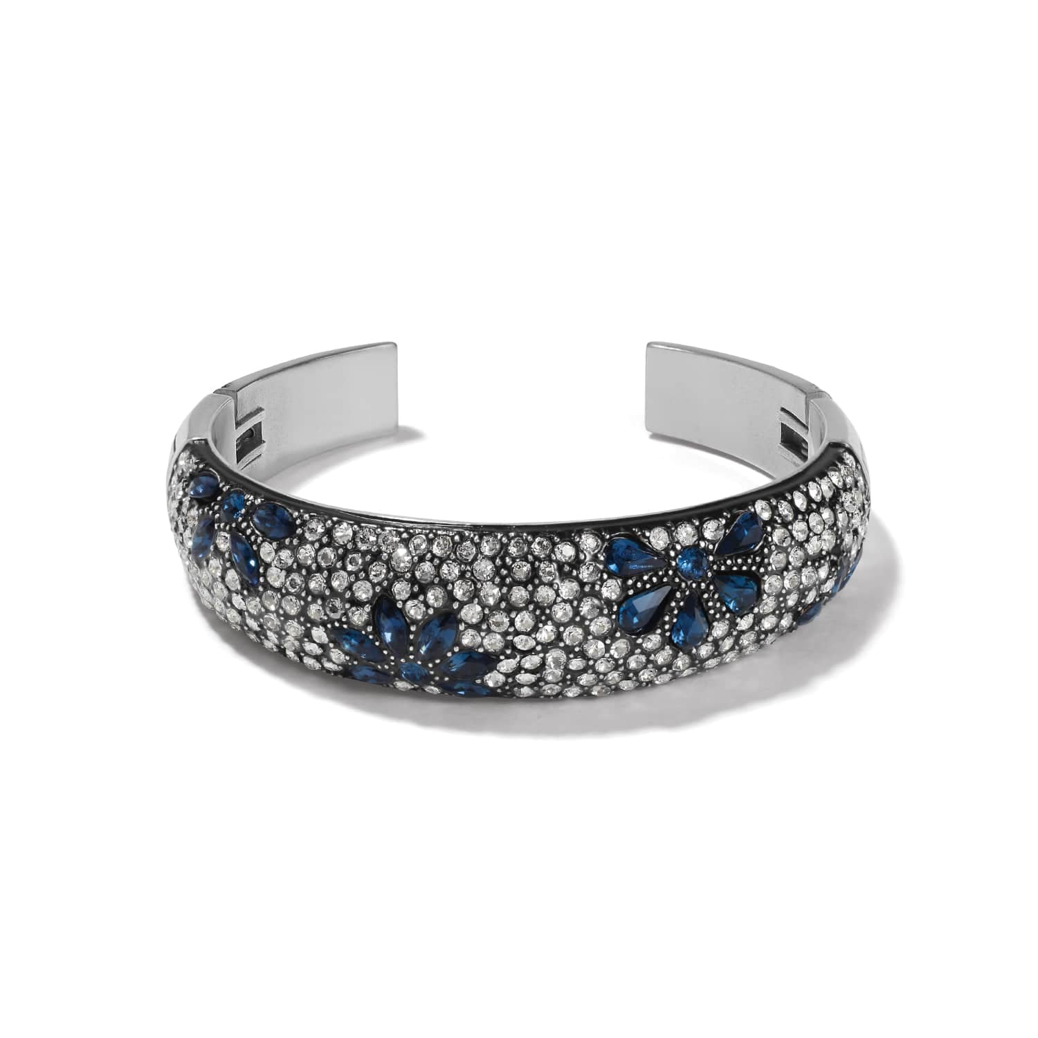 Brighton silver-tone cuff bracelet with blue and clear crystals in floral pattern and black lacquer on a white background