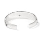 Brighton hinged cuff bracelet shown from the back with silver-plated finish and engraved heart logo on a white background