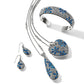Brighton jewelry set styled with silver-plated cuff bracelet, heart pendant necklace, and teardrop earrings featuring blue crystals