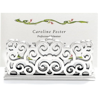 Brighton business card holder with silver-plated ornate scrollwork design holding a printed card on a white background