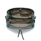 Close-up of Brighton green leather handbag interior view showing patterned fabric lining and multiple organizational compartments