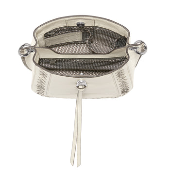 Brighton white leather handbag shown open with patterned fabric interior, zip pocket, and leather tassel on a white background