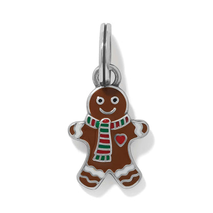 Brighton gingerbread man charm with brown enamel, red heart, striped scarf, and silver-plated finish on a white background