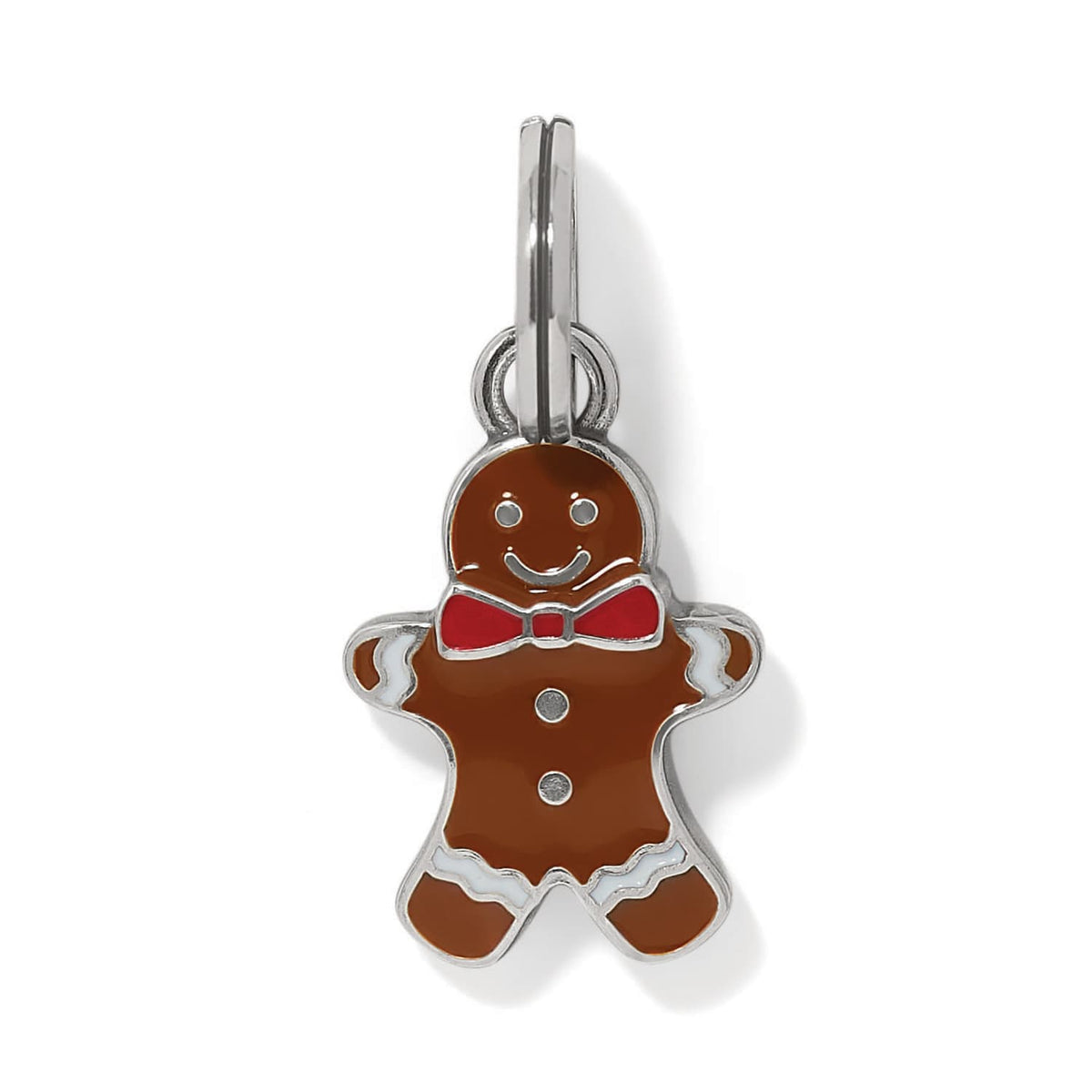 Brighton gingerbread man charm with brown enamel, red bow tie, and silver-plated accents on a white background
