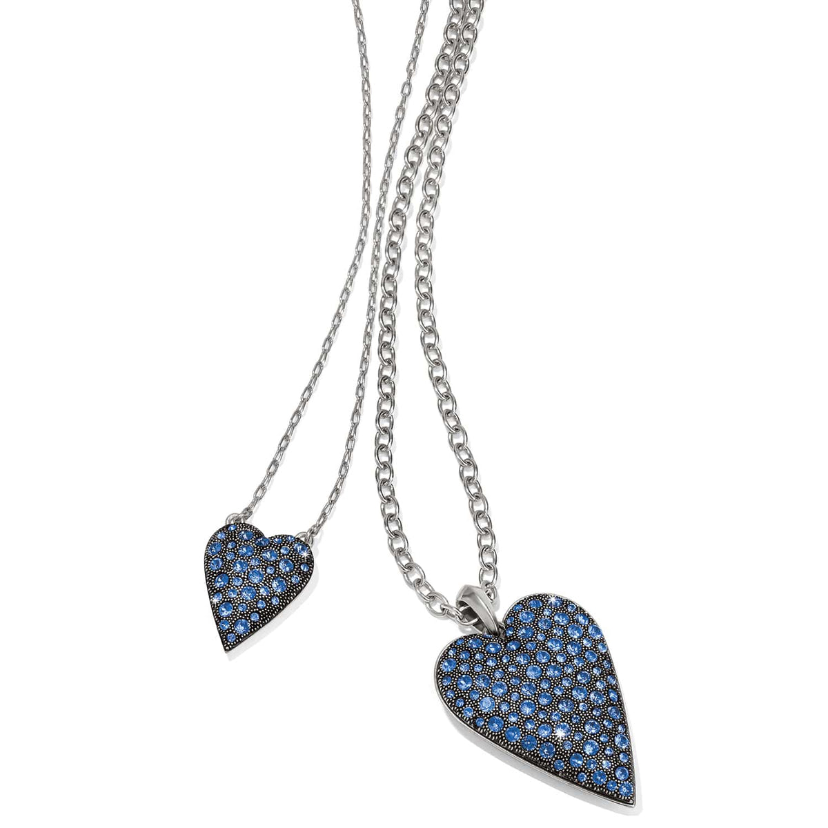 Brighton layered necklace with two silver-plated heart pendants featuring blue crystals on a white background