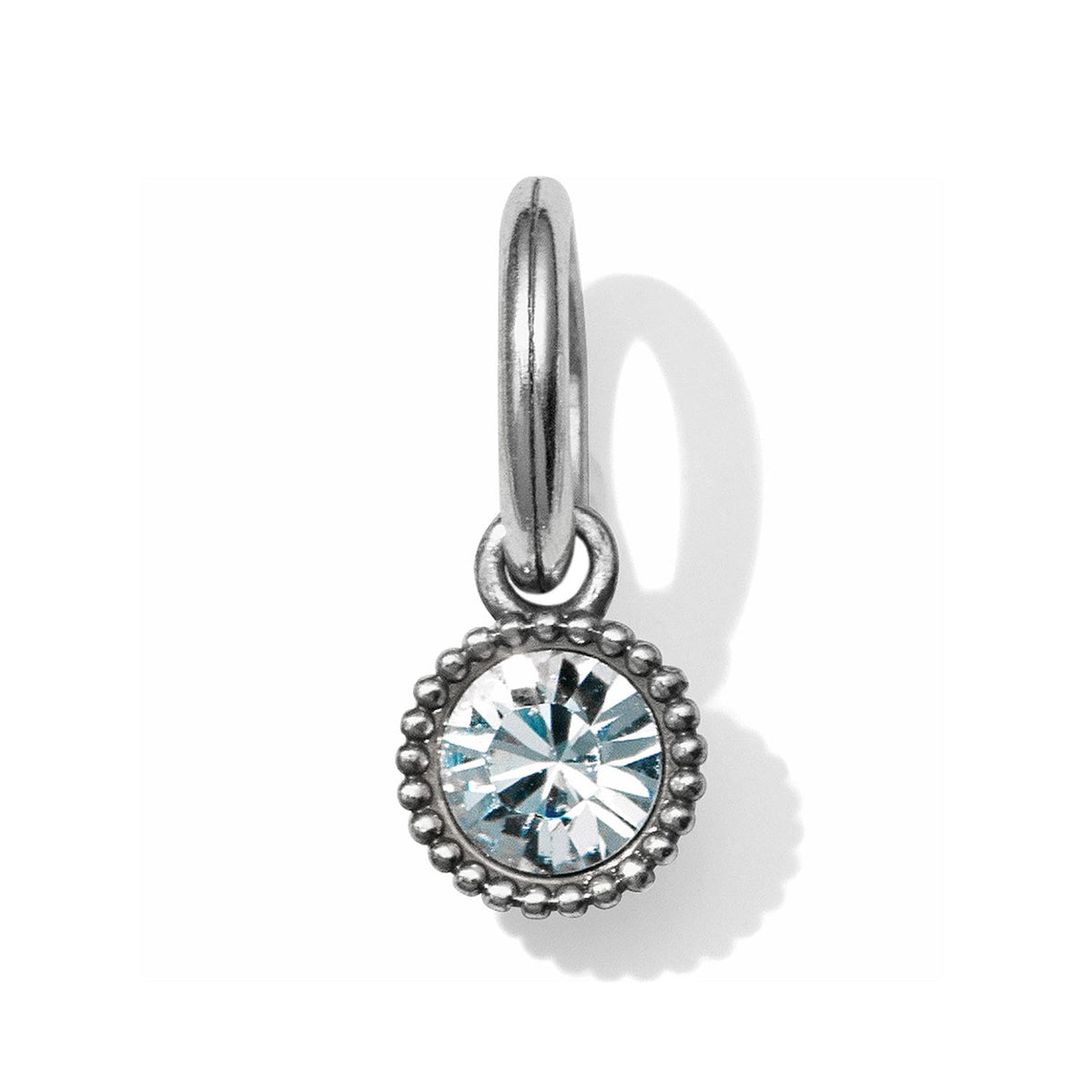 Brighton crystal charm with round faceted stone in beaded silver-tone bezel and split ring on a white background