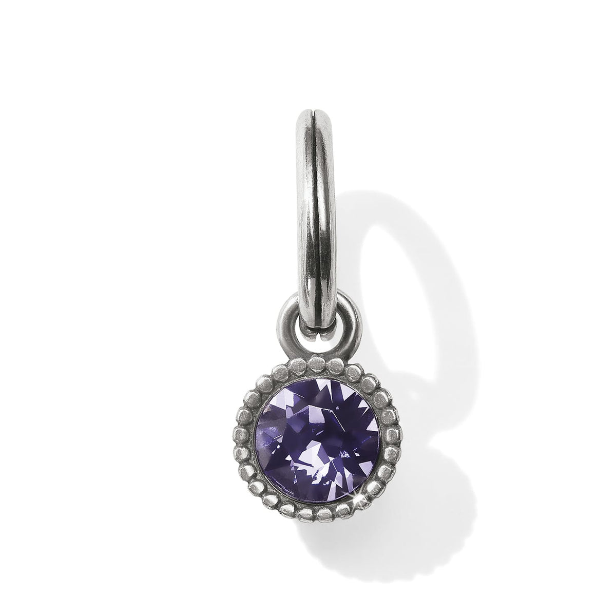Brighton charm with round purple crystal in beaded silver-tone bezel and split ring on a white background