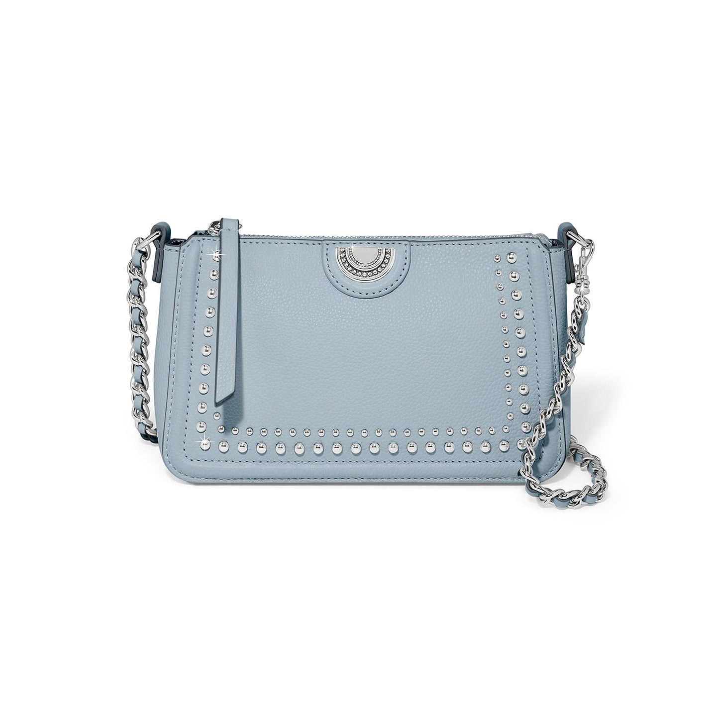 Brighton light blue crossbody handbag with silver-tone studs, medallion accent, and braided chain strap on a white background