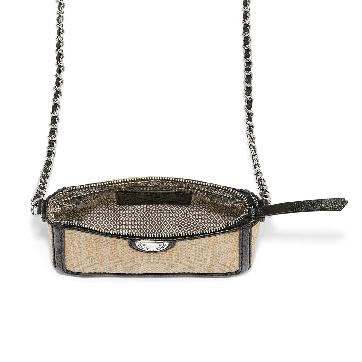 Brighton crossbody handbag shown open with woven straw body, black leather trim, and silver-tone chain strap on a white background
