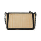 Brighton woven straw handbag shown from the back with black leather trim and silver-tone chain strap on a white background