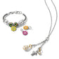 Brighton silver-tone charm bracelet styled with enamel floral charms and a chain necklace with gold-plated crystal charms