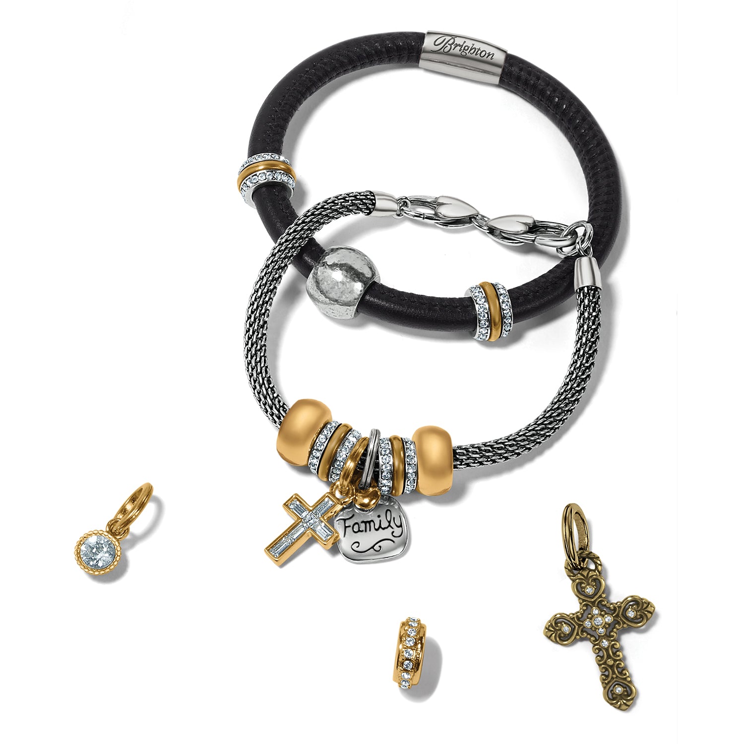 Brighton bracelets styled with gold-plated crystal charms and cross pendants on a white background